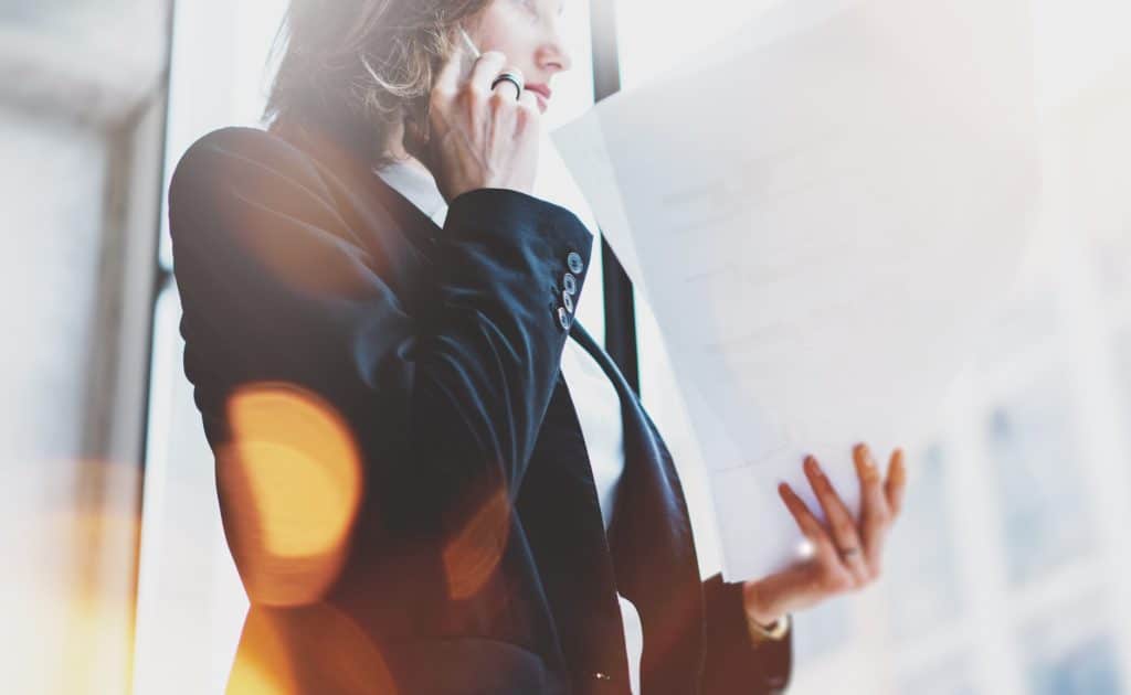 Business woman talking on smartphone.